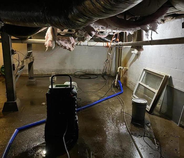 flooded basement, oil furnace nearby